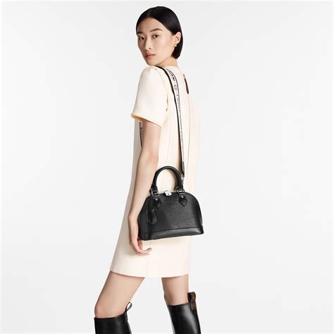 Discover Louis Vuitton Alma BB One of the Houses most recognizable bags, the adorable Alma BB handbag gets a sporty makeover thanks to a new Jacquard strap. . Alma bb epi leather